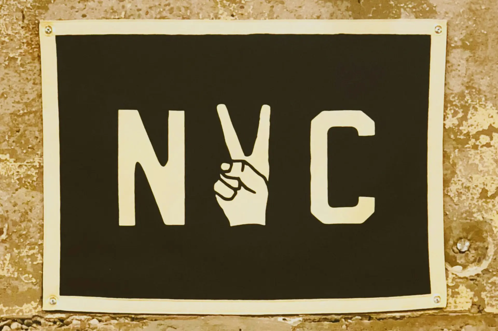 New York City sign with two finger peace sign
