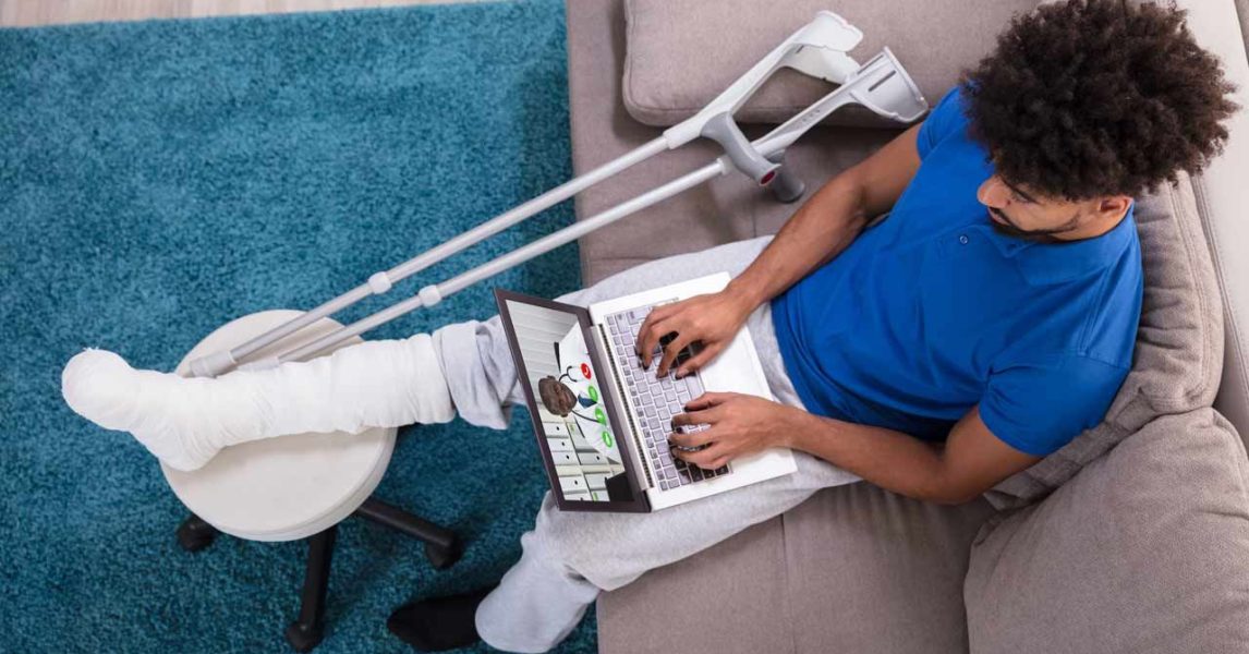Person on a virtual care visit with an apparent leg injury